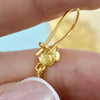 Intricate filigree craftsmanship detail on angel wing gold plated silver earrings