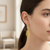 Elegant angel wing statement earrings styled with women's vintage inspired jewelry