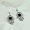 Intricate handmade sterling silver filigree on Hamsa earrings with Black Onyx