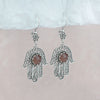 Hand of Fatima sterling silver earrings with intricate filigree and Cherry Quartz