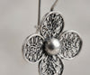 Handmade sterling silver filigree craftsmanship on floral daisy earrings