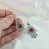 Handmade sterling silver filigree craftsmanship on Hamsa earrings with Carnelian
