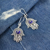 Hand of Fatima sterling silver earrings with intricate filigree and evil eye stone