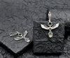 Handmade sterling silver Phoenix earrings with intricate filigree feather design