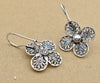 Handmade sterling silver filigree craftsmanship on floral daisy earrings