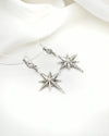 Oxidized sterling silver Polaris starburst earrings with traditional filigree design