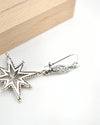 Handmade Polaris North Star filigree earrings with celestial sterling silver starburst design